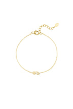 Delicate gold bracelet with minimalist leaf charm, elegant and timeless design