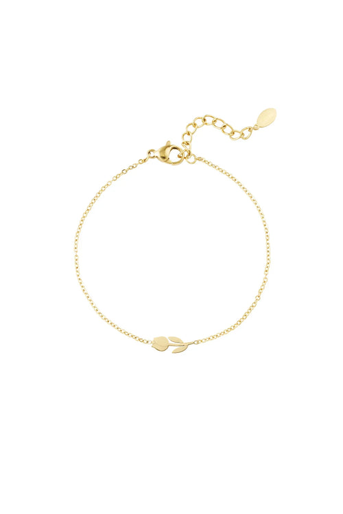 Delicate gold bracelet with minimalist leaf charm, elegant and timeless design
