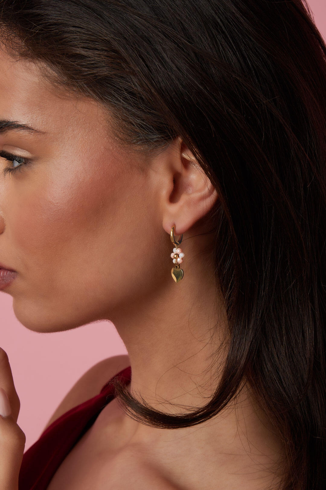 Earrings with a heart on a beaded flower